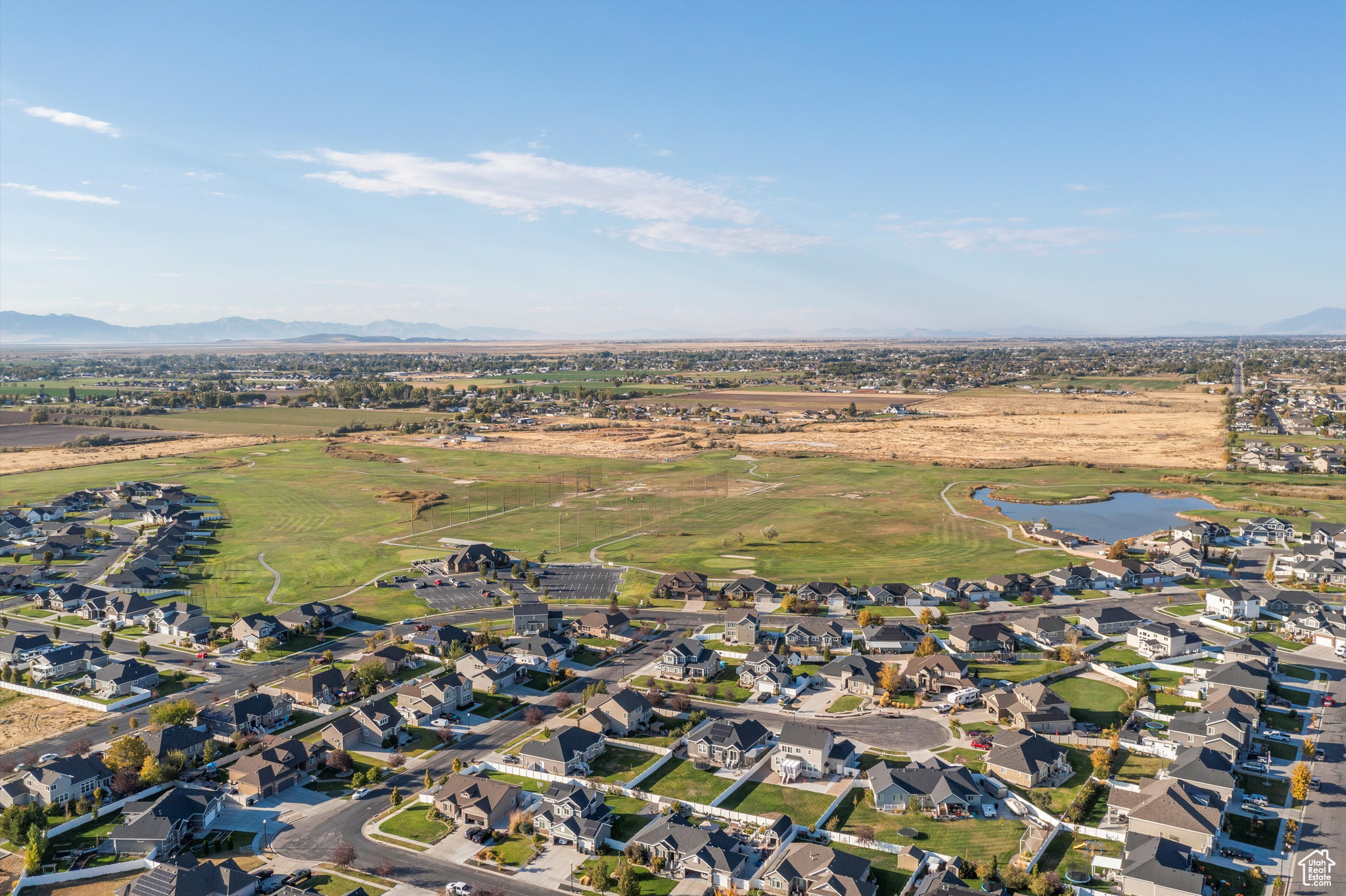 Birds eye view of property with a water and mountain view