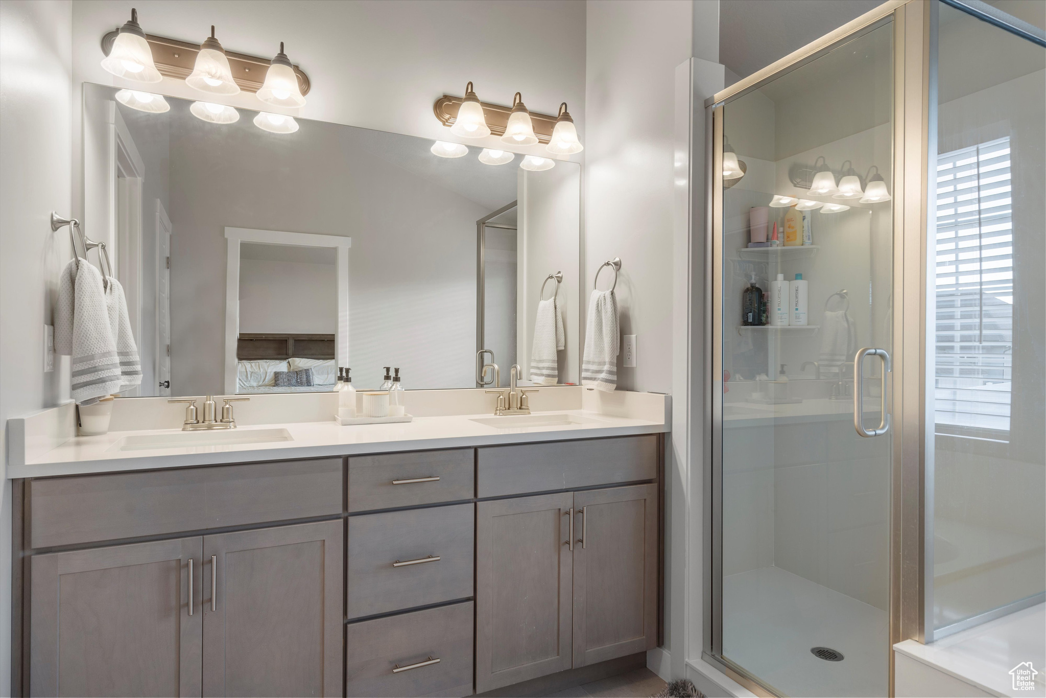 Master bathroom featuring walk in shower and vanity