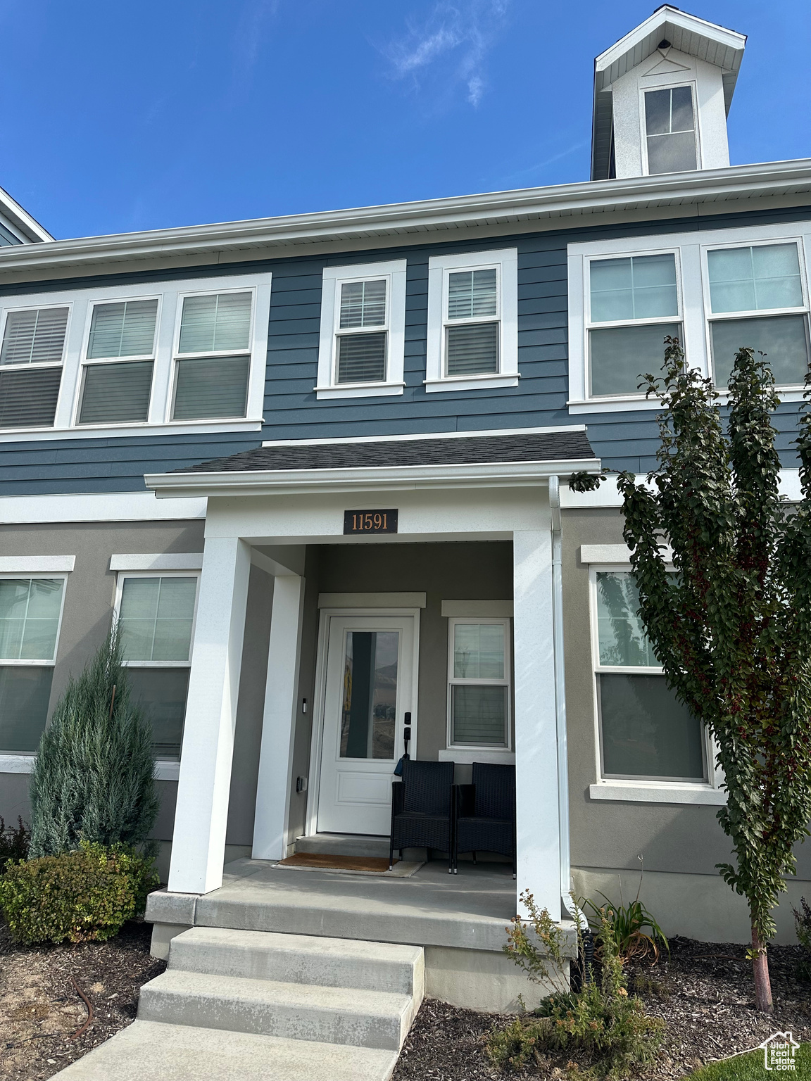 Entrance to property featuring covered porch