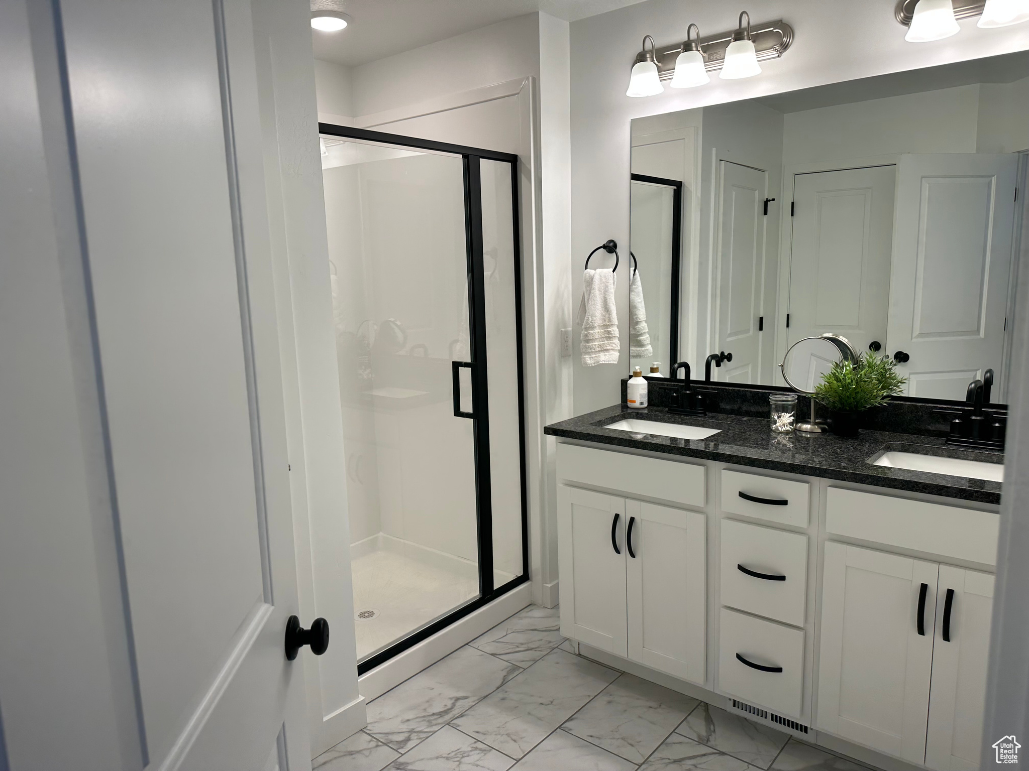 Master Bathroom featuring an enclosed shower and vanity