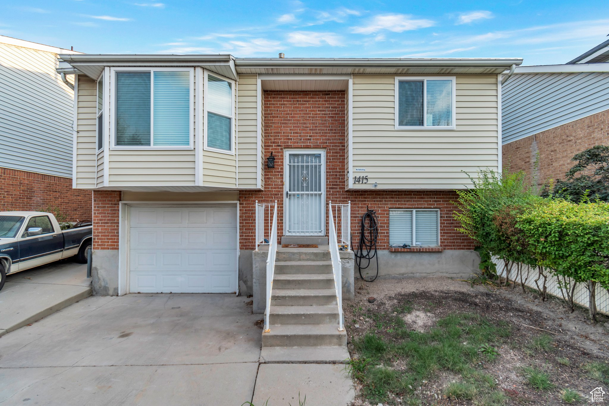 View of front of home featuring a garage