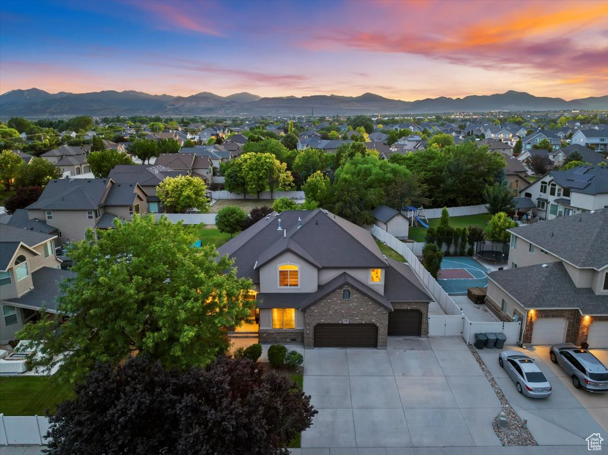 Aerial view at dusk featuring a mountain view