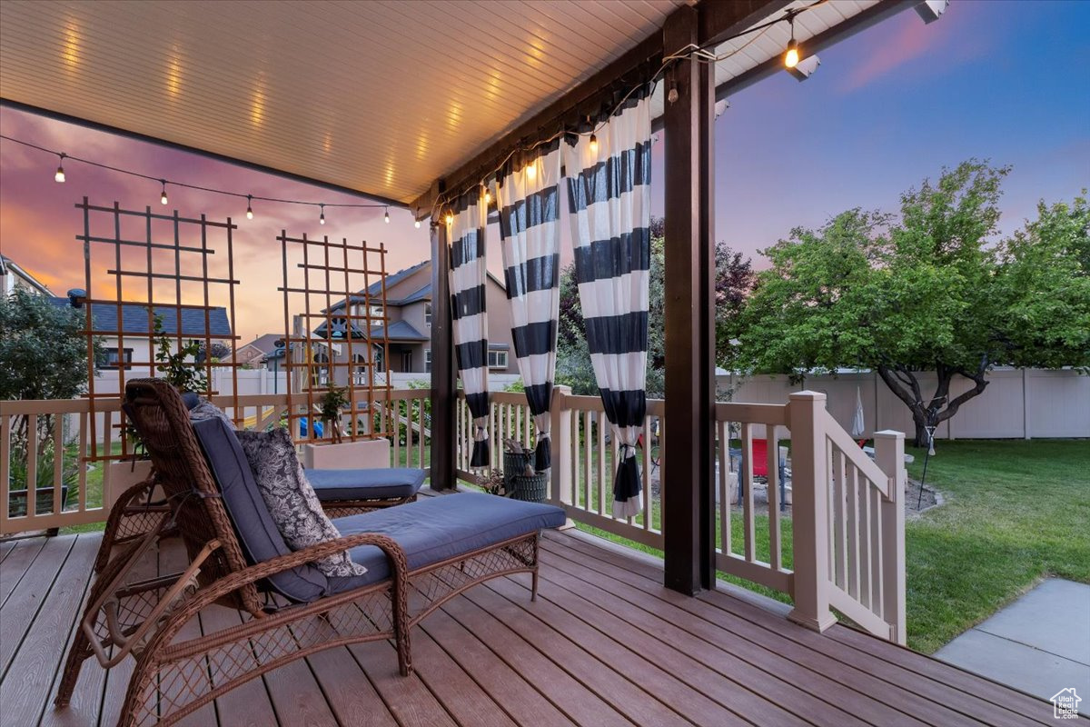 Deck at dusk with a lawn