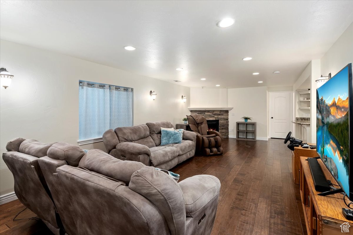 Living room featuring a fireplace and dark hardwood / wood-style floors