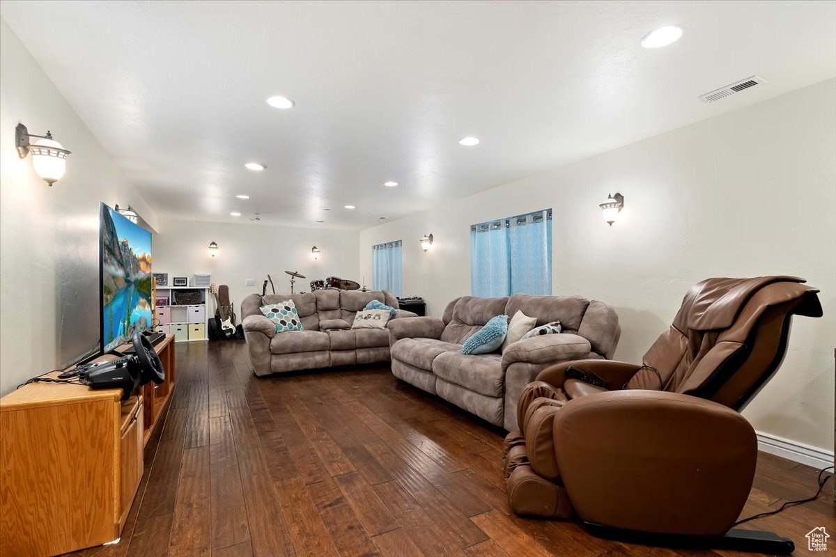 Living room featuring dark wood-type flooring