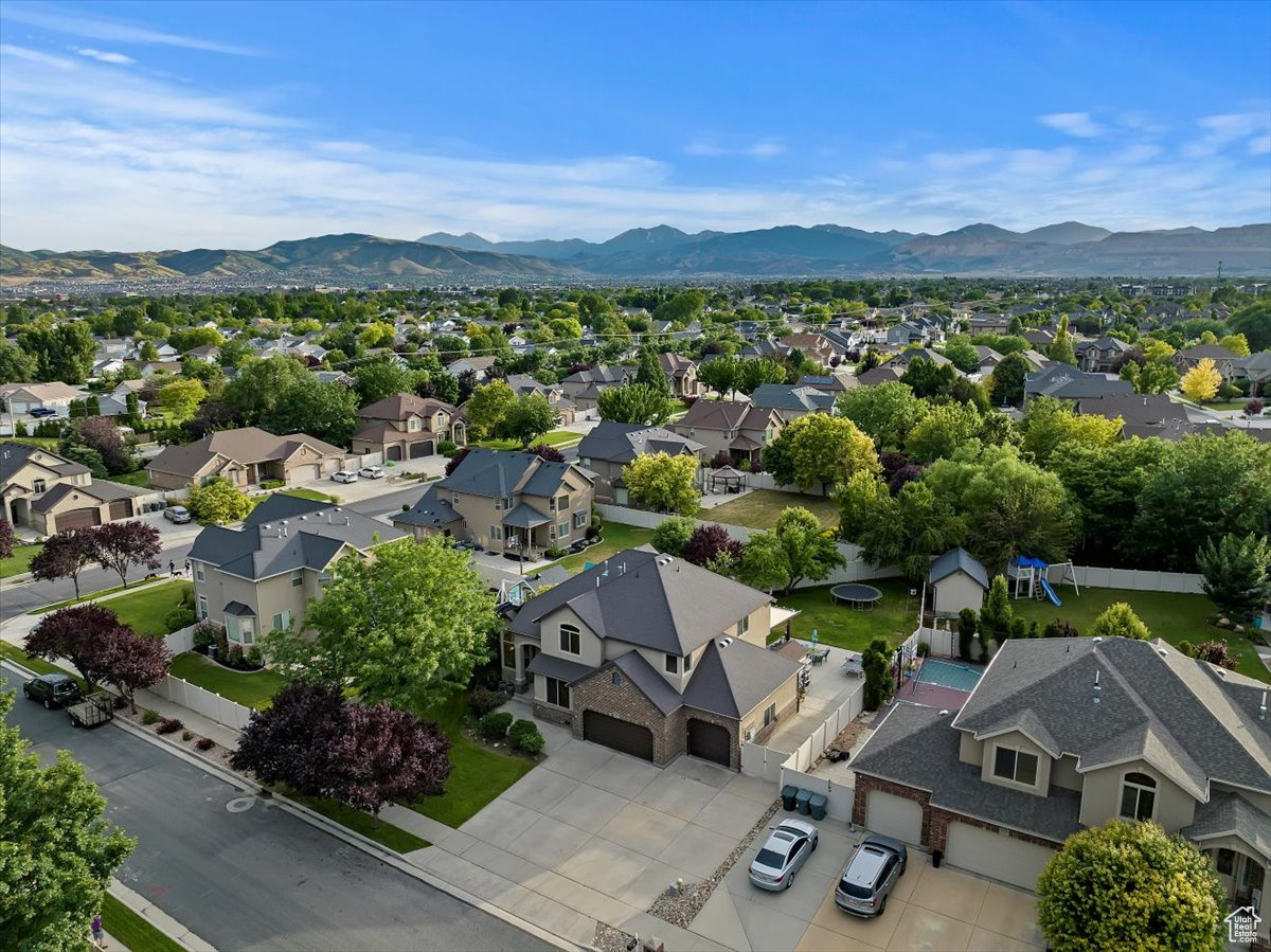 Birds eye view of property with a mountain view