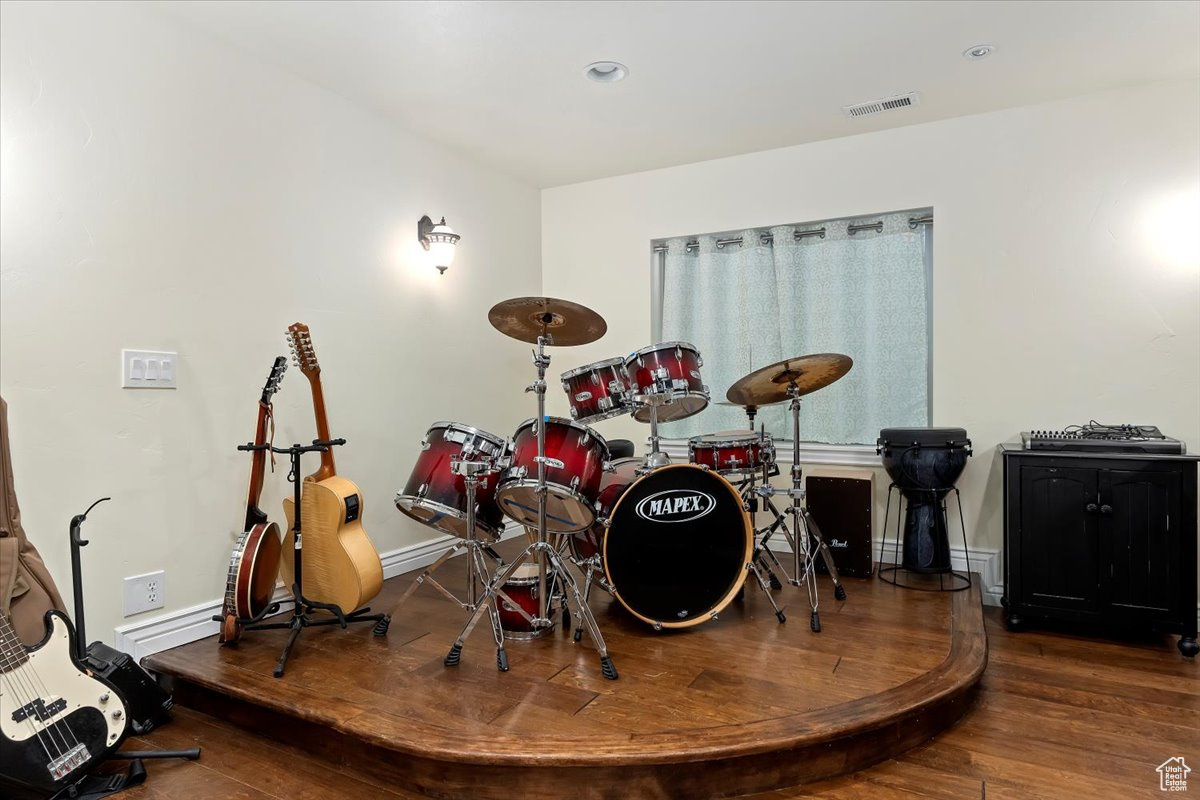 Miscellaneous room with dark hardwood / wood-style flooring