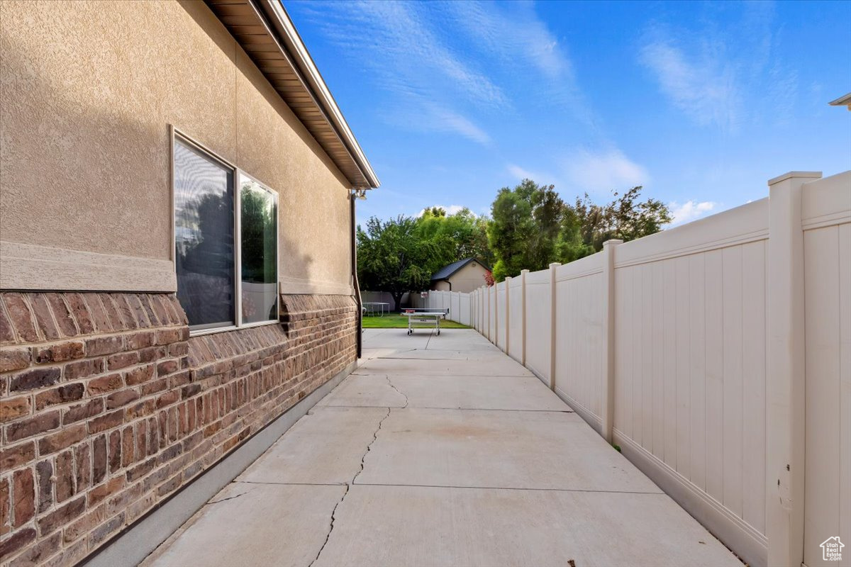 View of side of property featuring a patio