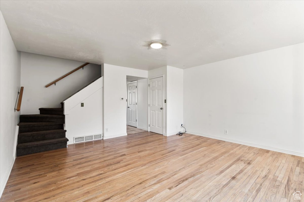 Living room: light hardwood / wood-style floors