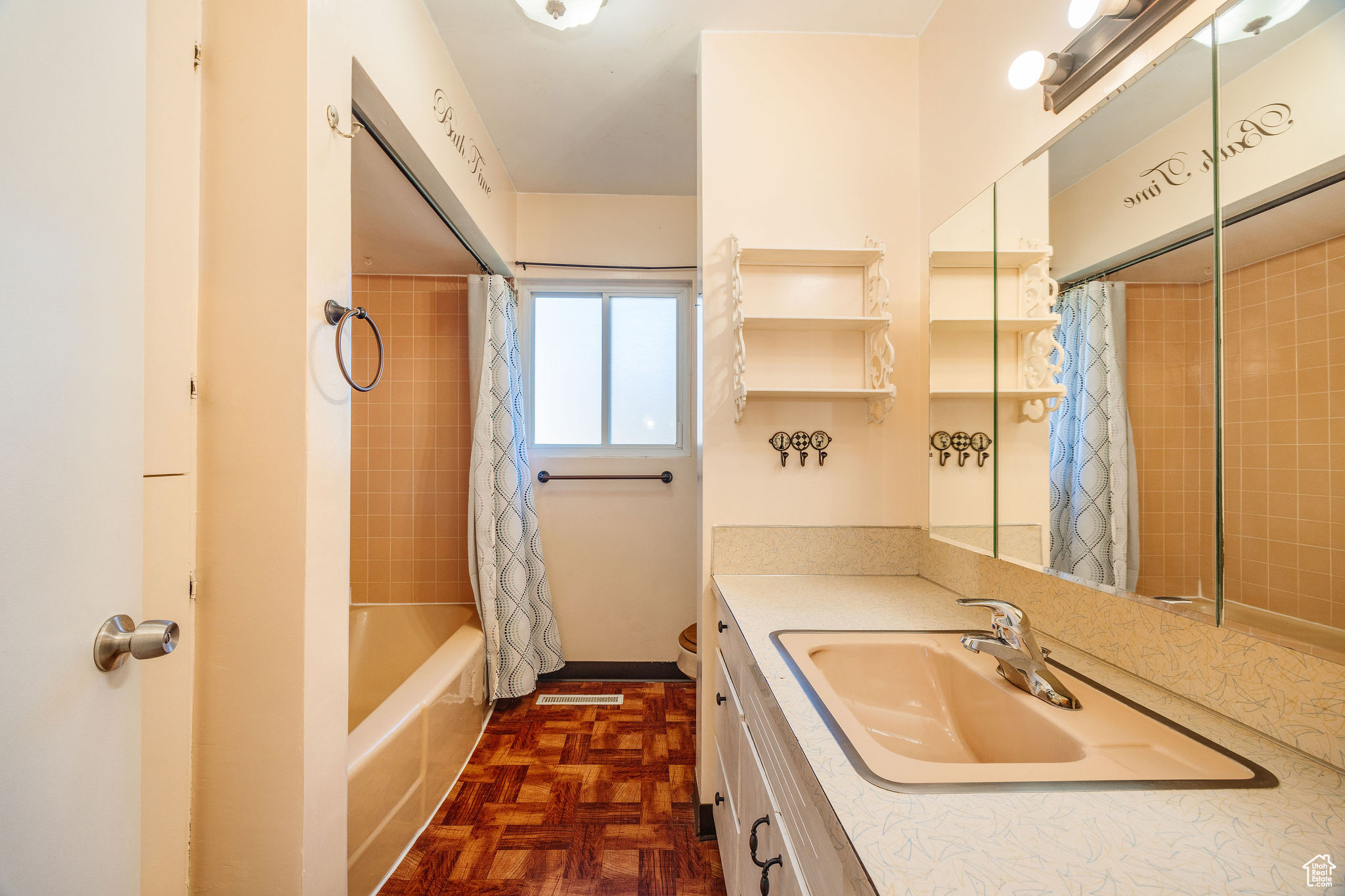 Full bathroom, toilet, vanity, and shower / bath combo with shower curtain