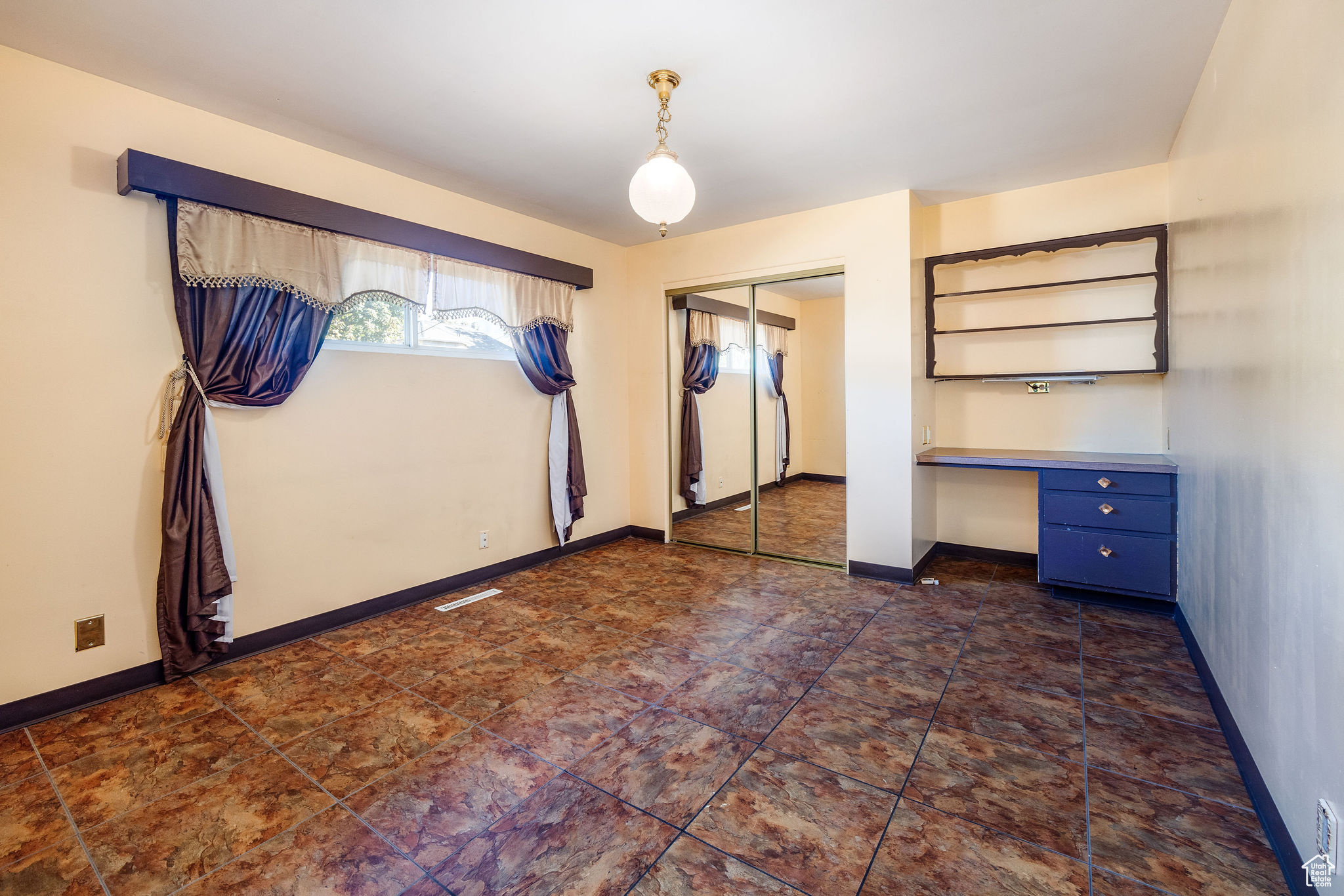 Bedroom 2 with built-in desk and closet