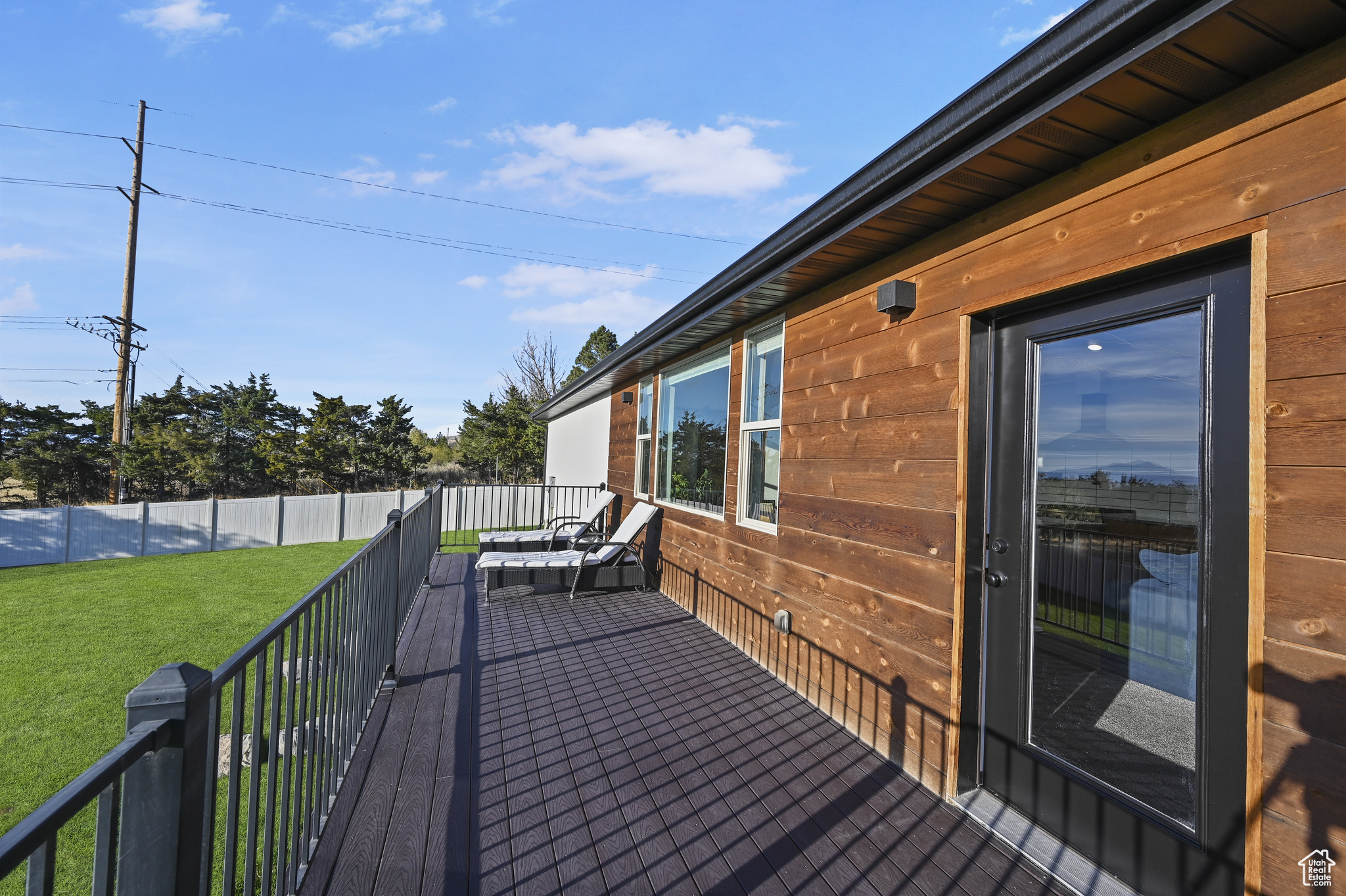 Wooden terrace with a yard