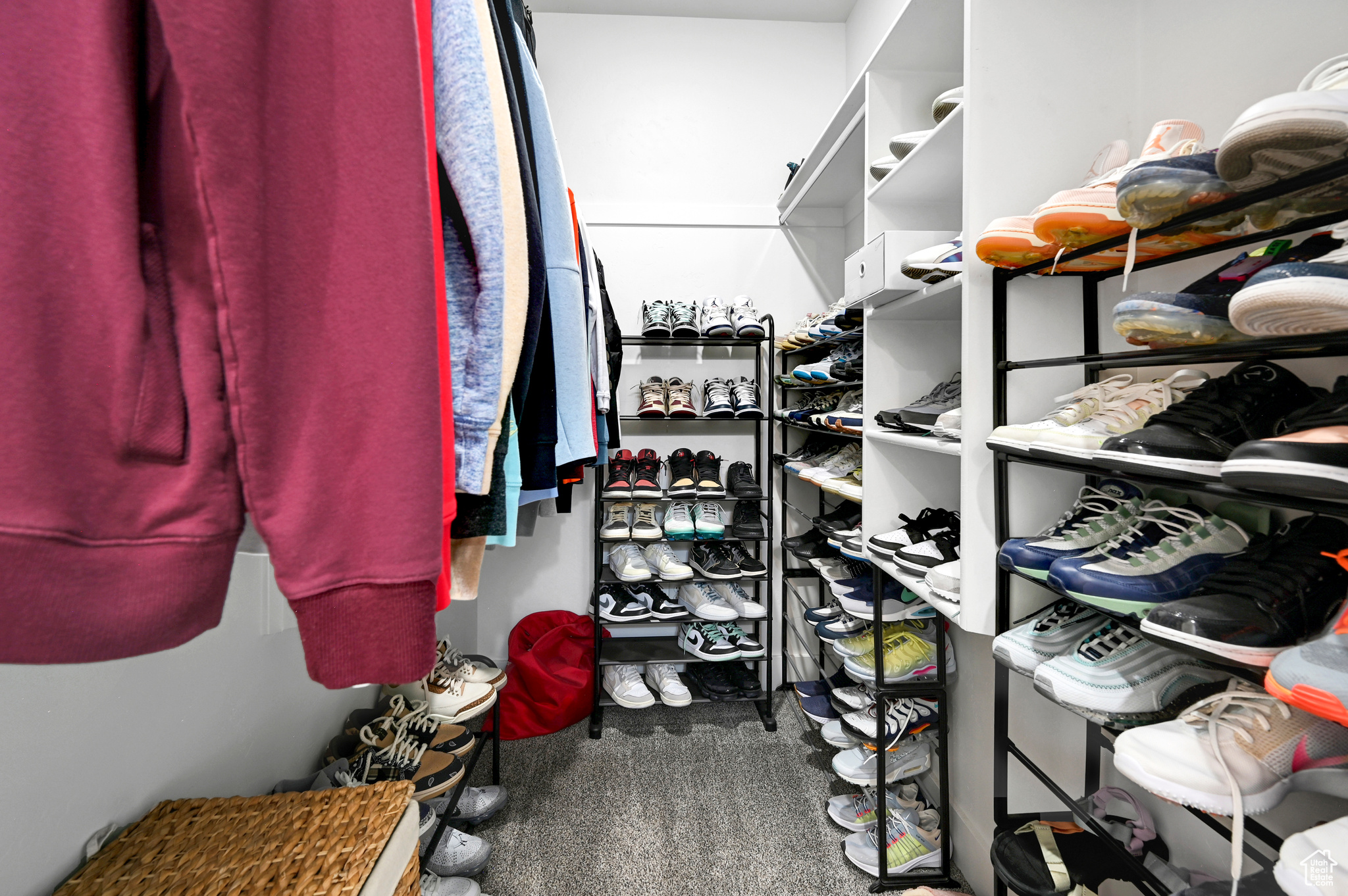 Walk in closet with carpet flooring