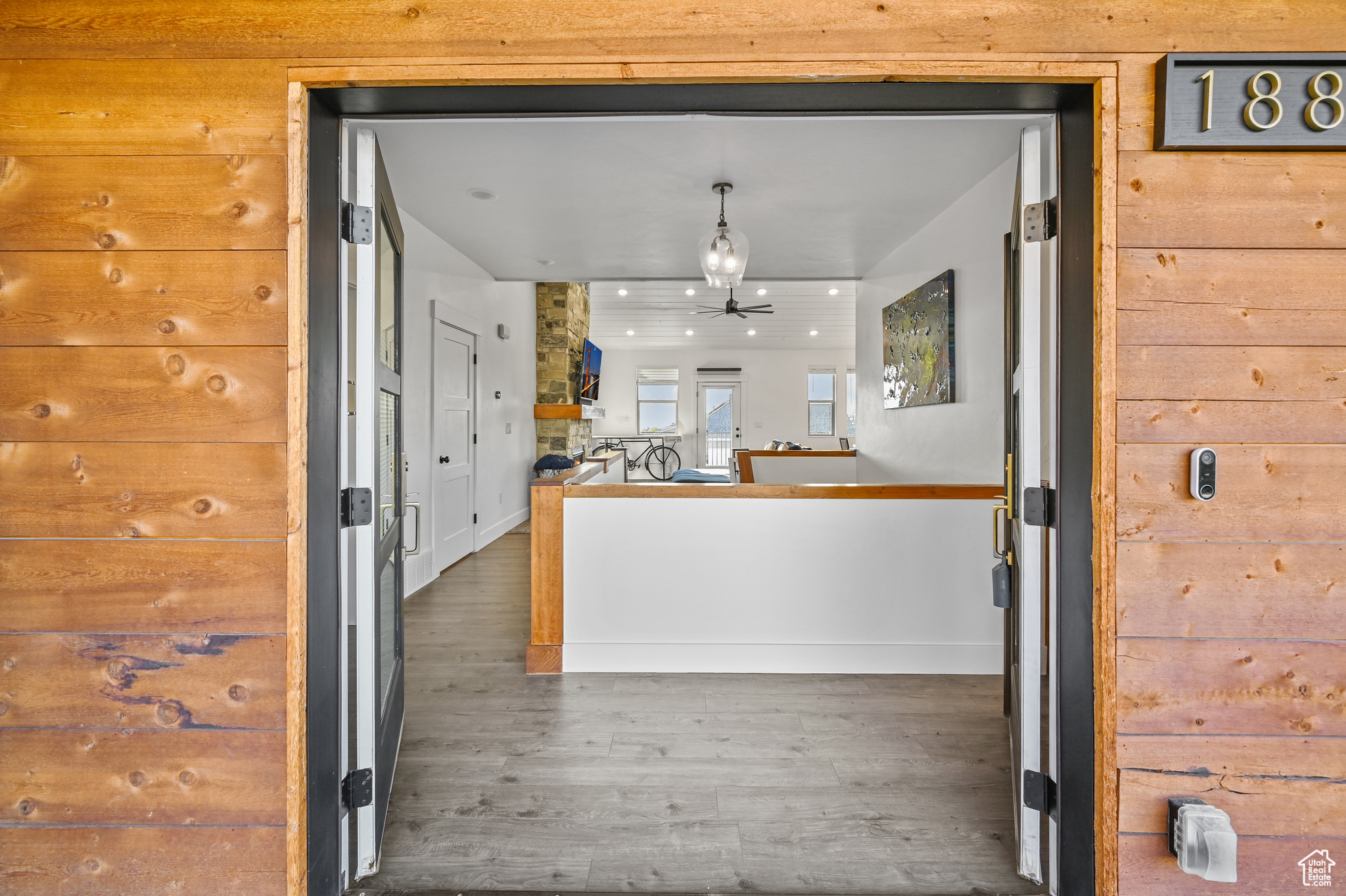 Kitchen featuring ceiling fan and dark hardwood / wood-style flooring