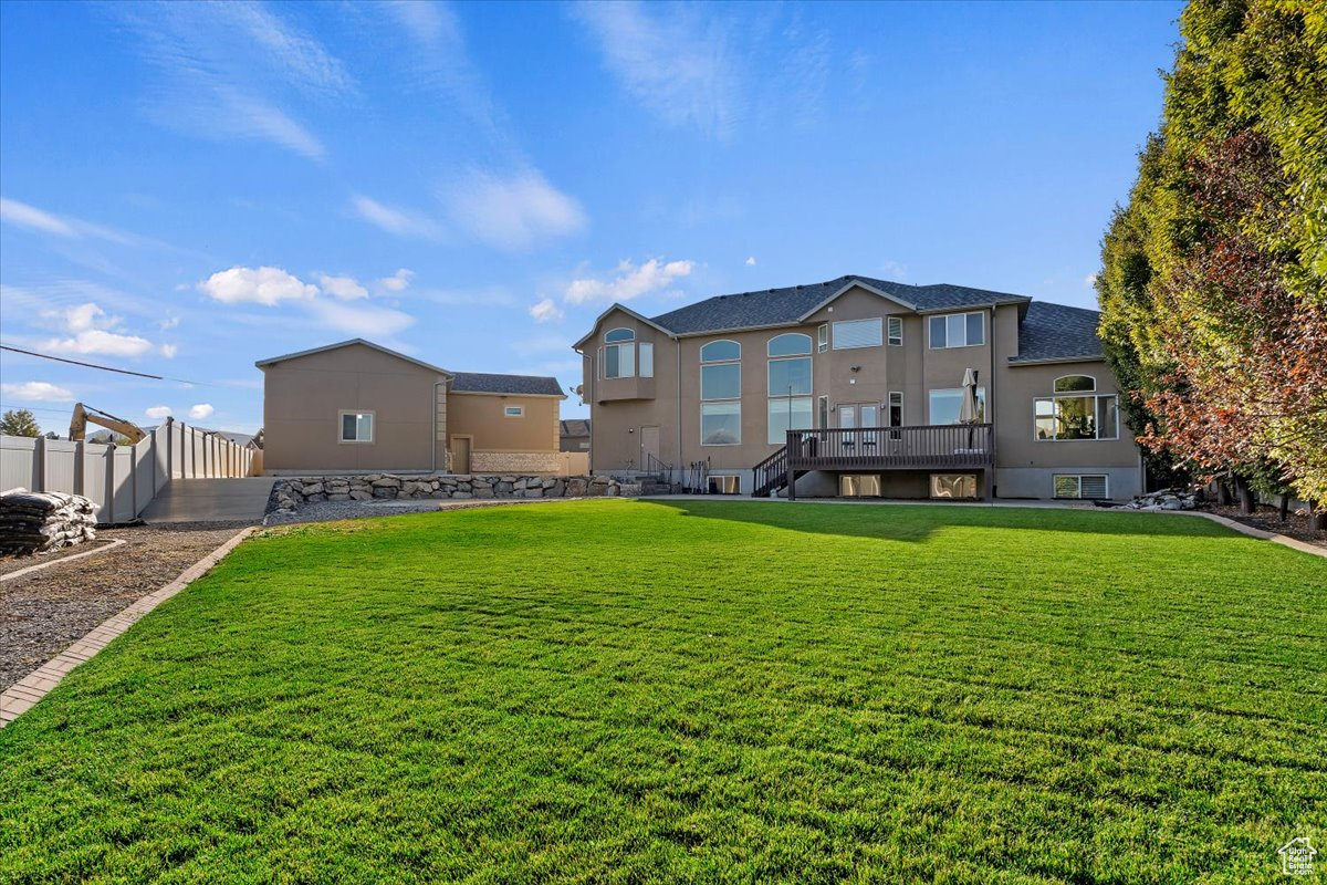 View of yard with a wooden deck