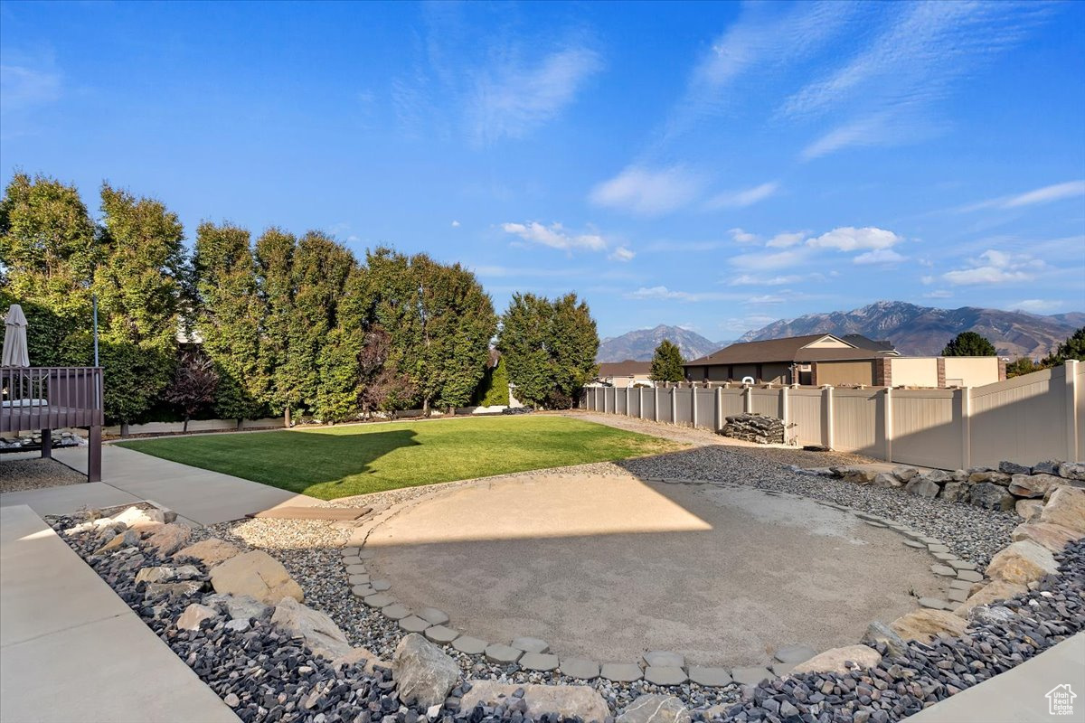 View of yard with a mountain view and a patio