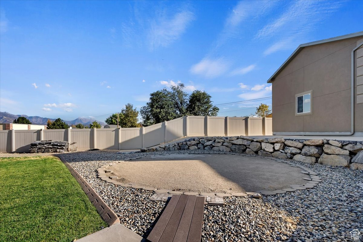 View of yard featuring a mountain view and a patio area