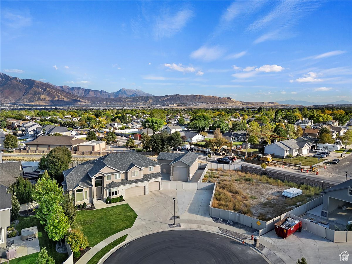 Birds eye view of property with a mountain view