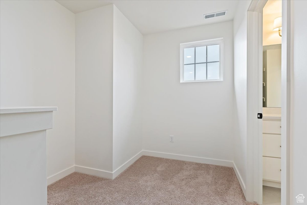 View of carpeted spare room