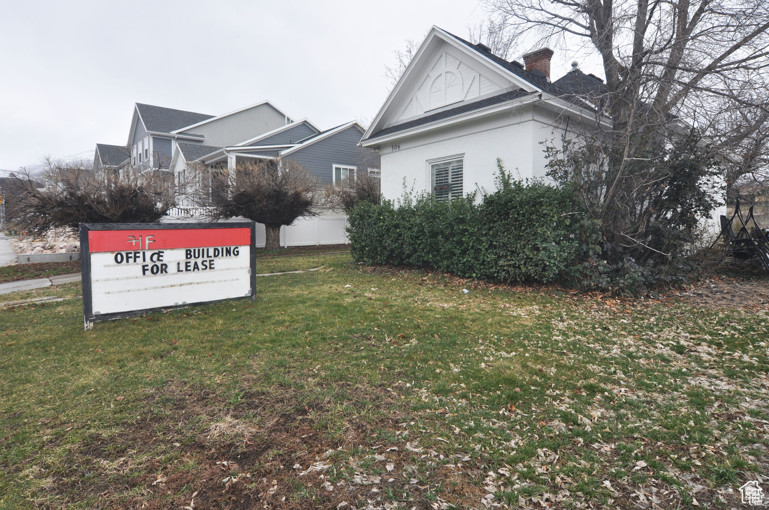 View of property exterior with a yard