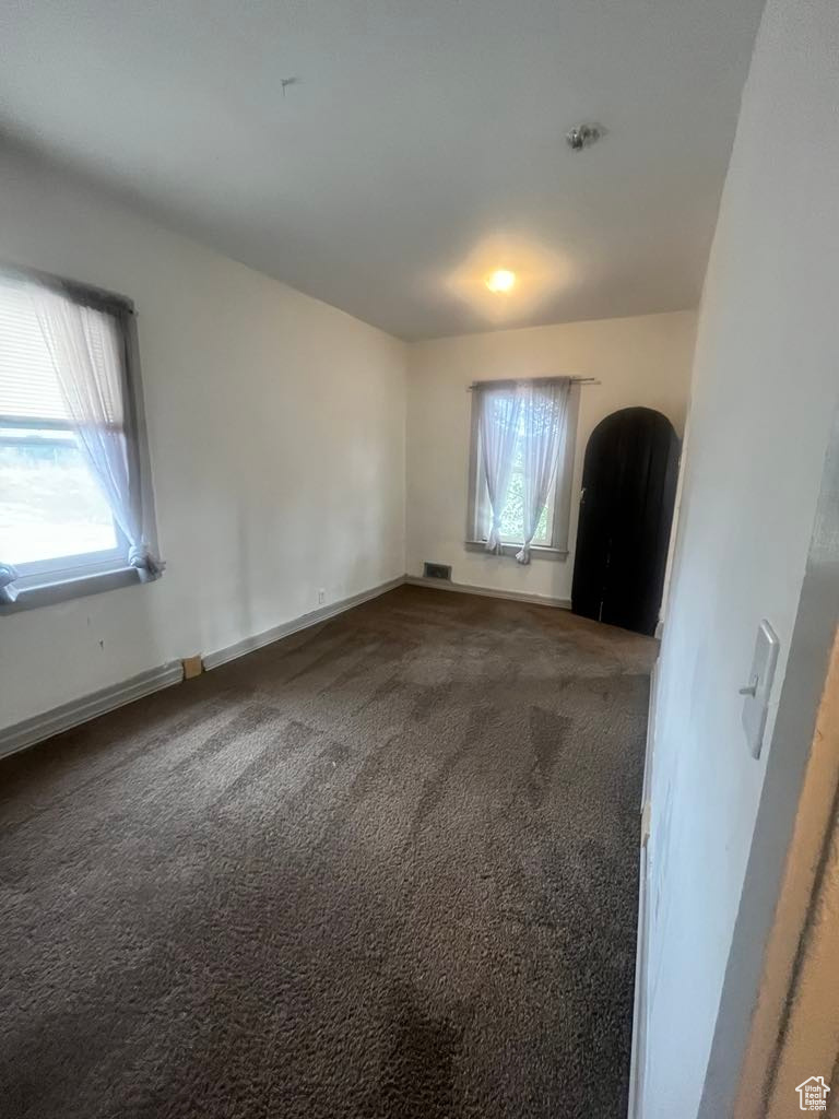 Empty room featuring carpet flooring