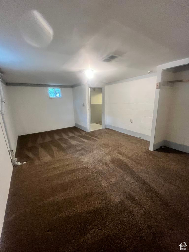 Basement featuring carpet flooring