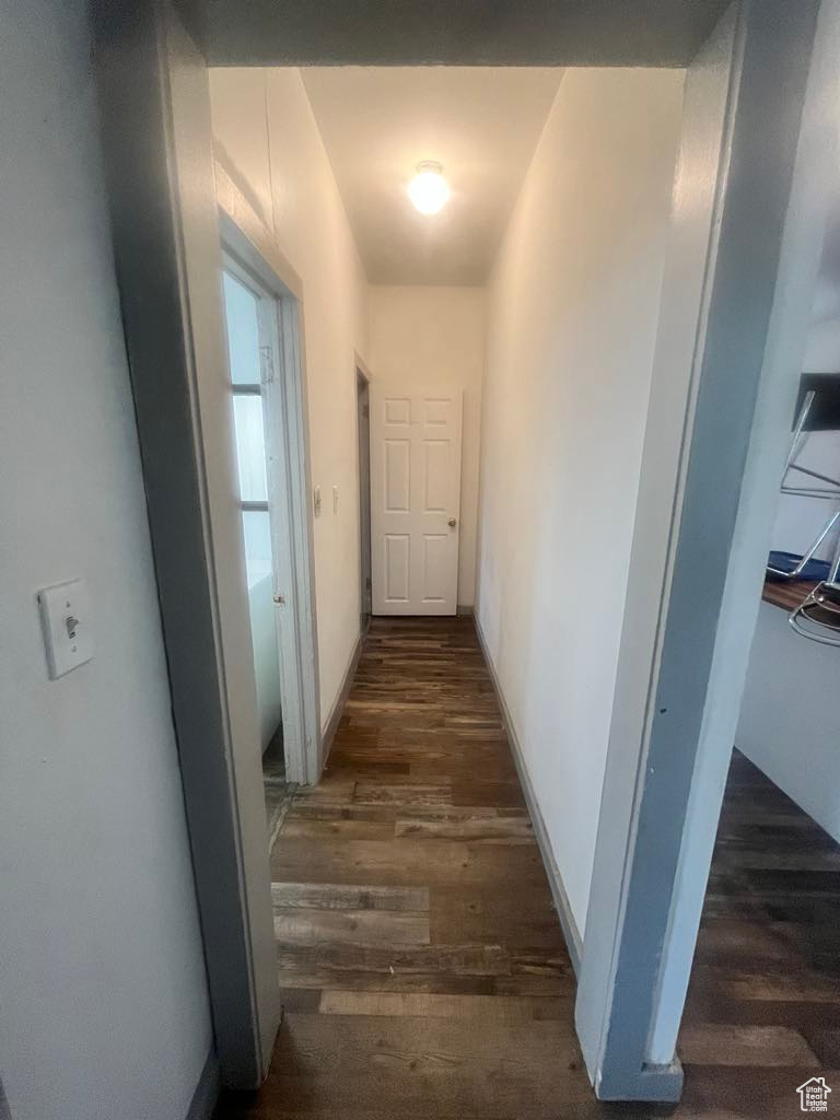 Corridor featuring dark hardwood / wood-style floors