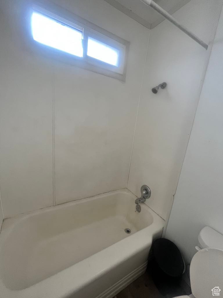 Bathroom with tub / shower combination and toilet