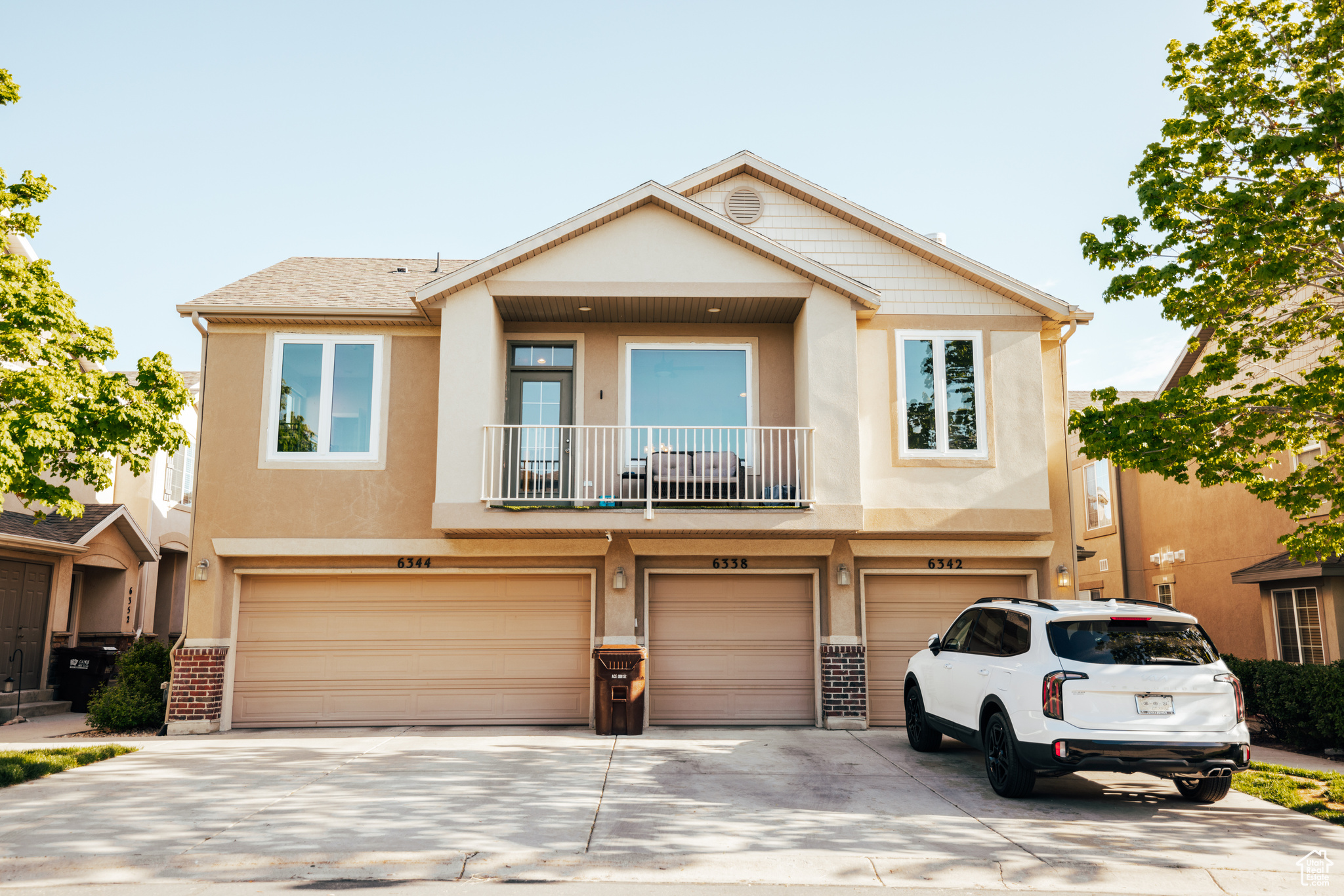 Townhome / multi-family property featuring a garage