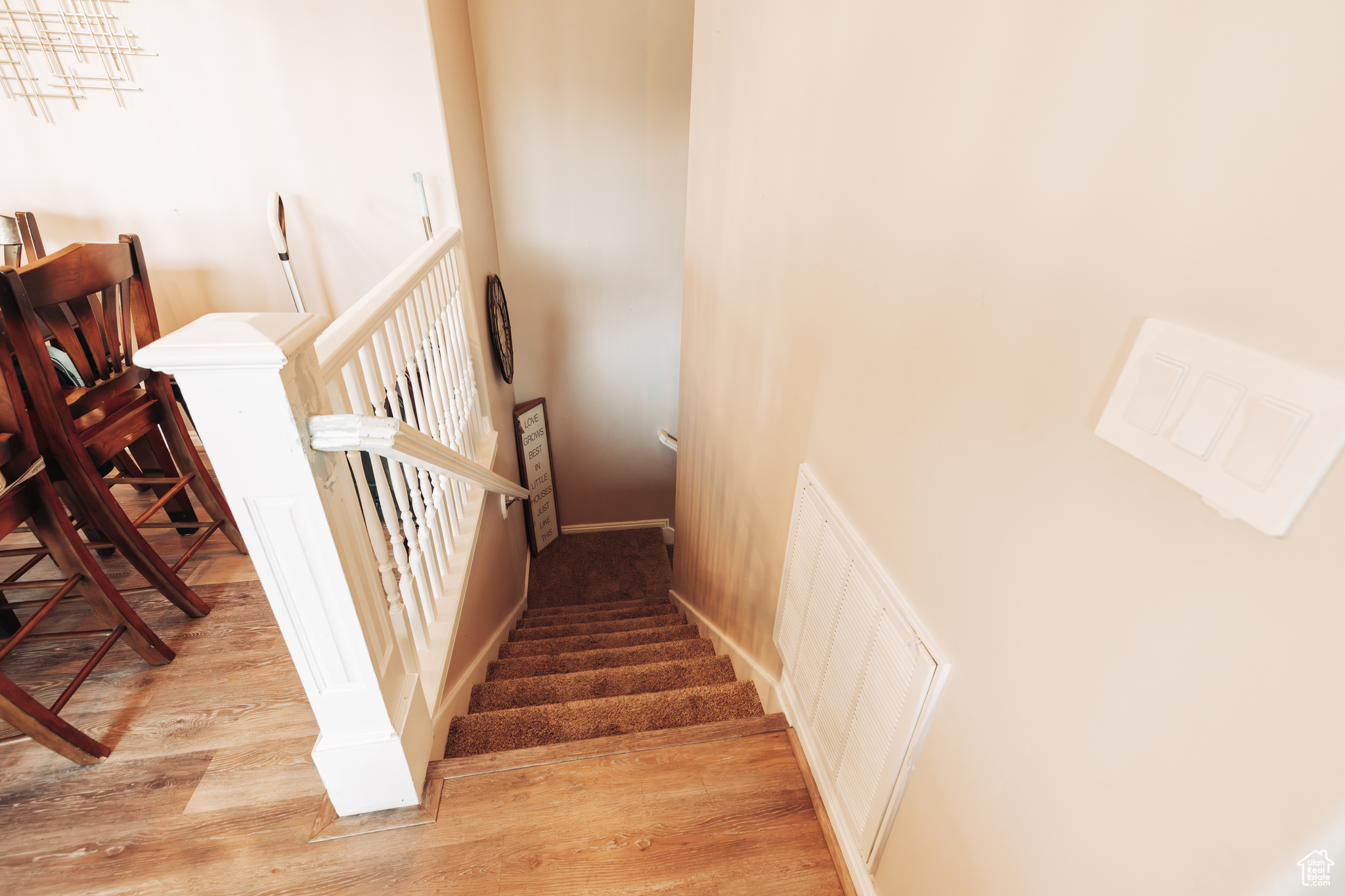 Stairway with hardwood / wood-style flooring