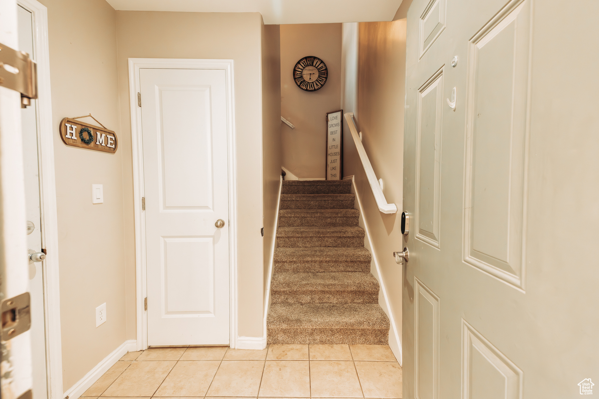 Stairs with tile patterned floors