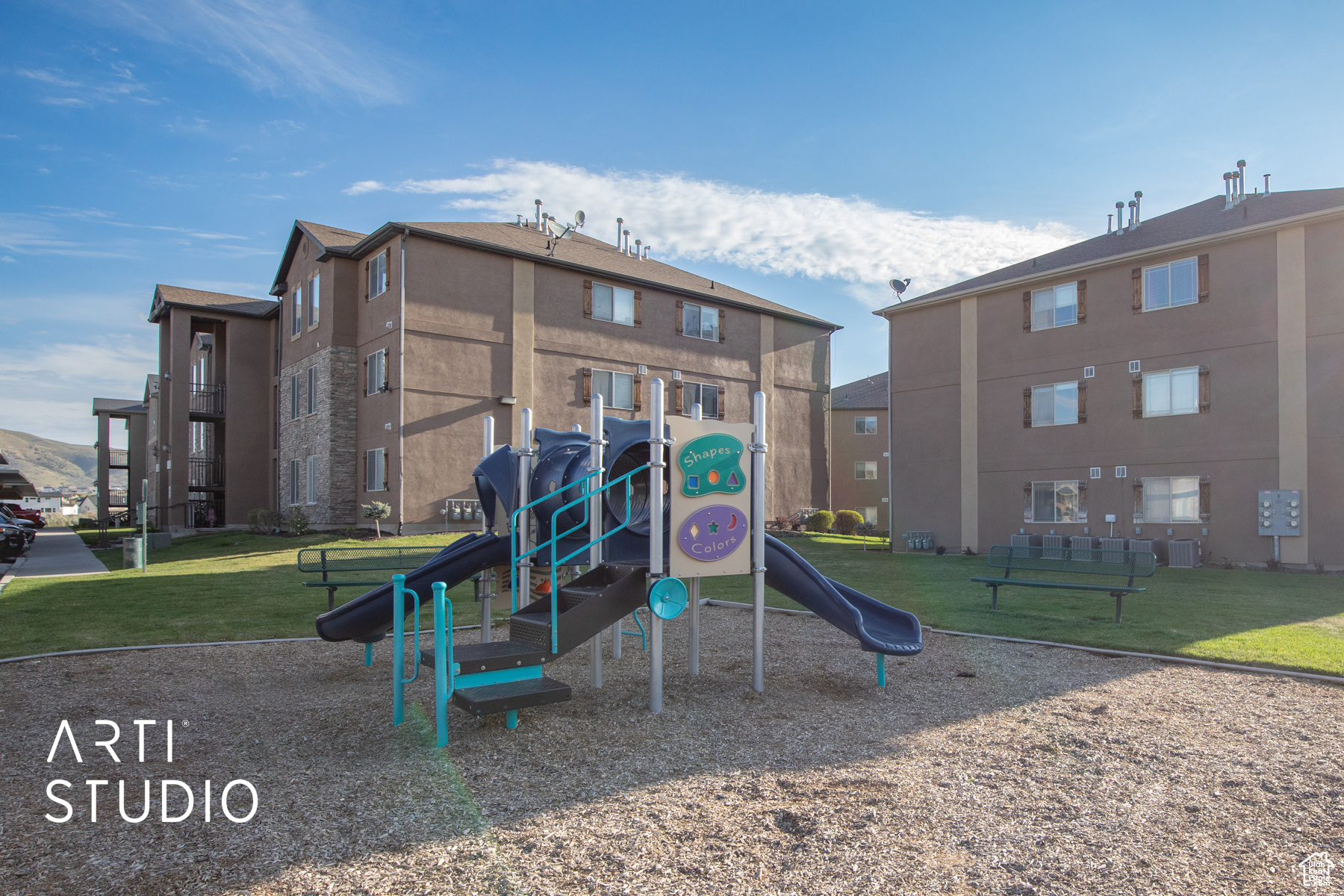 View of play area featuring a lawn