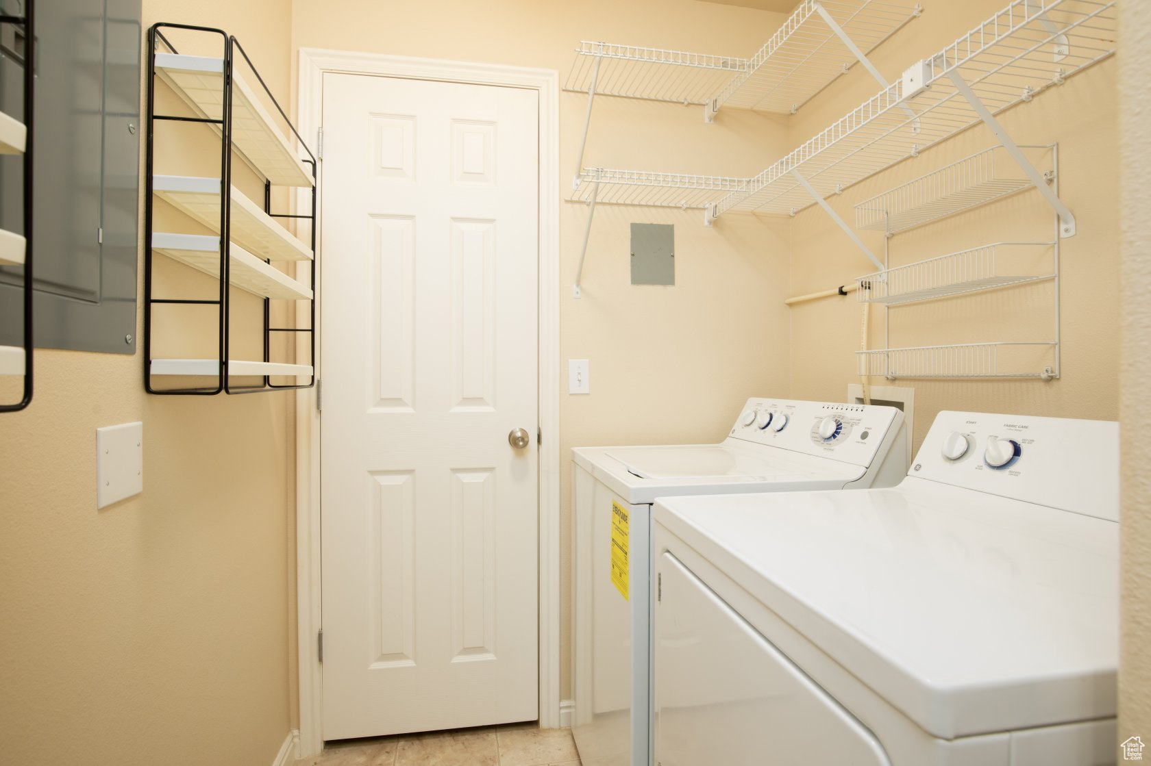 Clothes washing area with electric panel and washer and clothes dryer