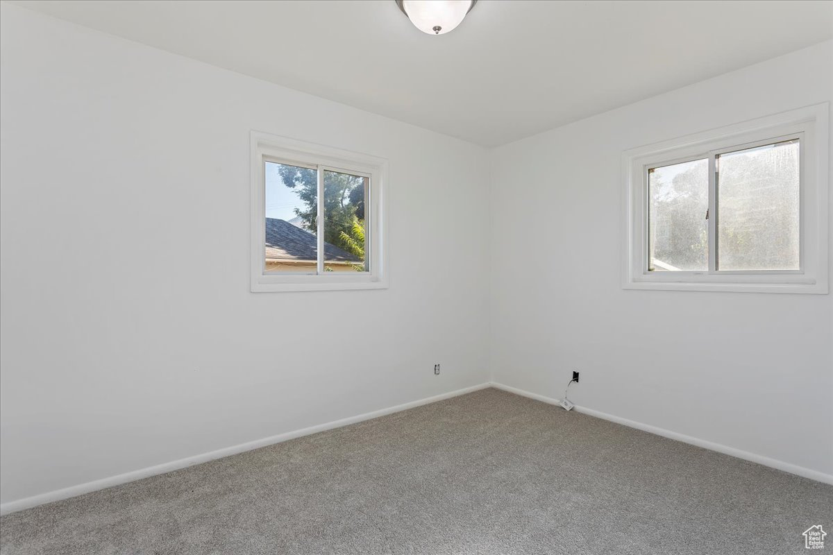 View of carpeted spare room