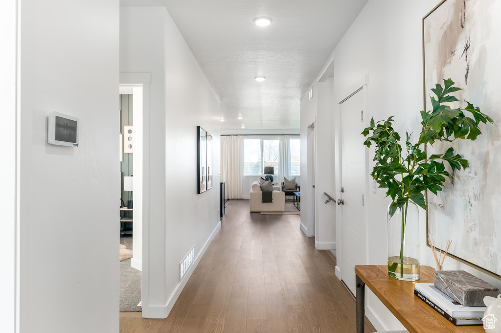 Hallway featuring hardwood / wood-style floors