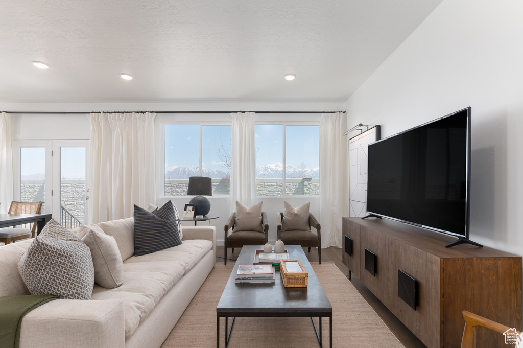 Living room with light hardwood / wood-style floors