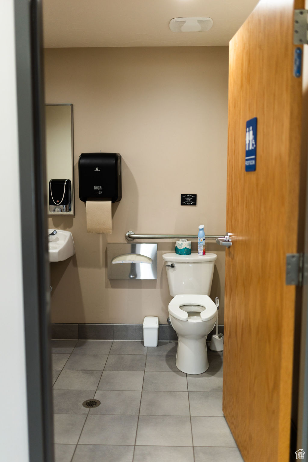 Bathroom with toilet and tile patterned floors