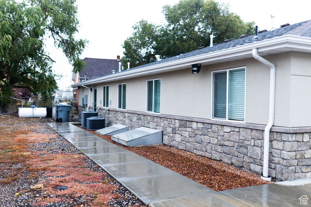 View of side of home with a patio