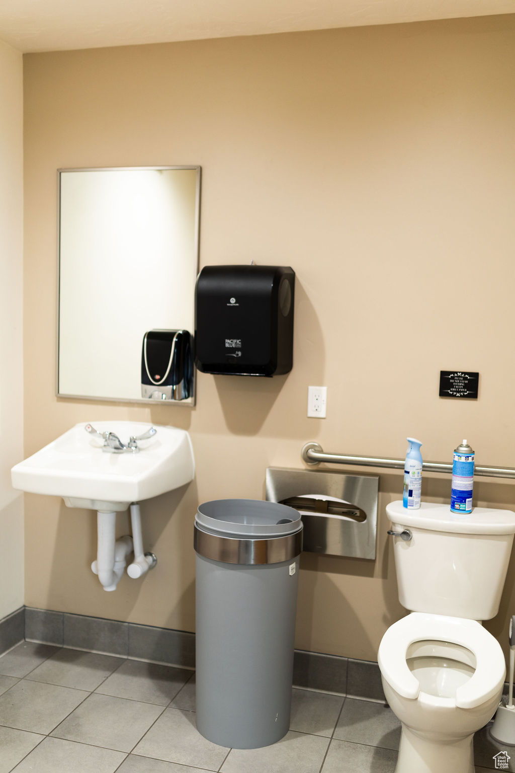 Bathroom featuring toilet and tile patterned flooring