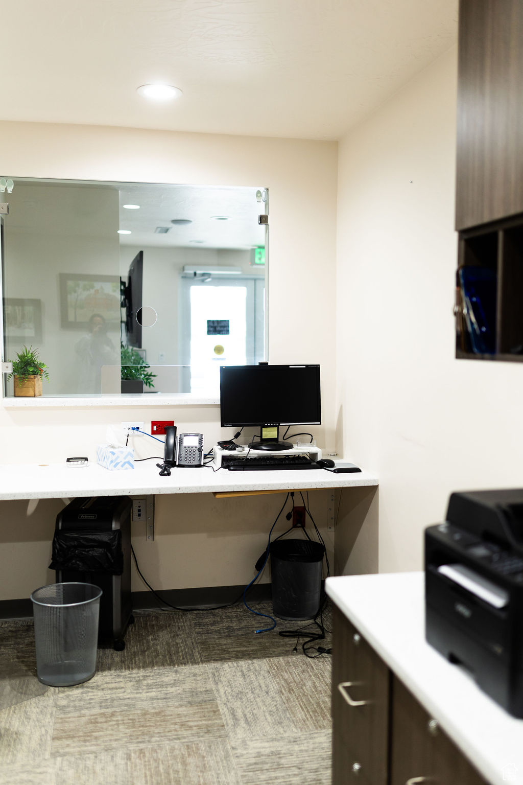 Carpeted office featuring built in desk