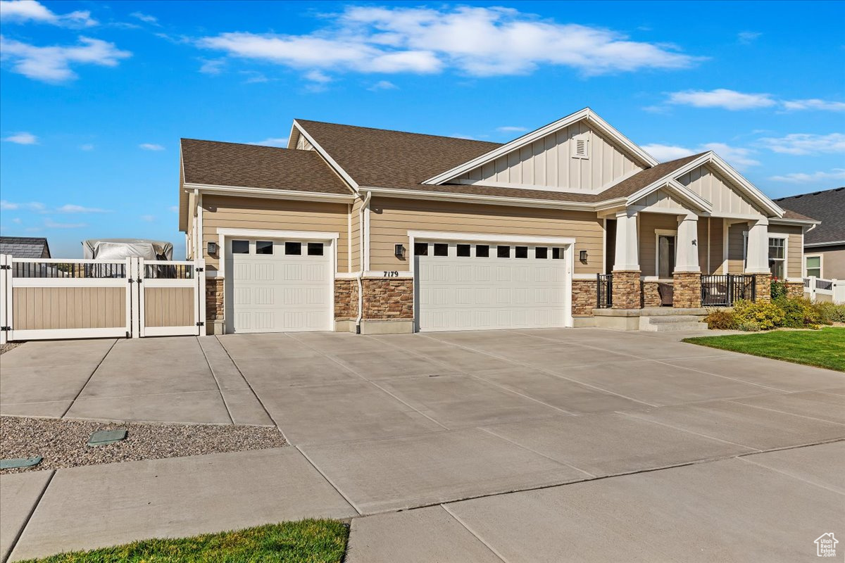 Craftsman house featuring a garage