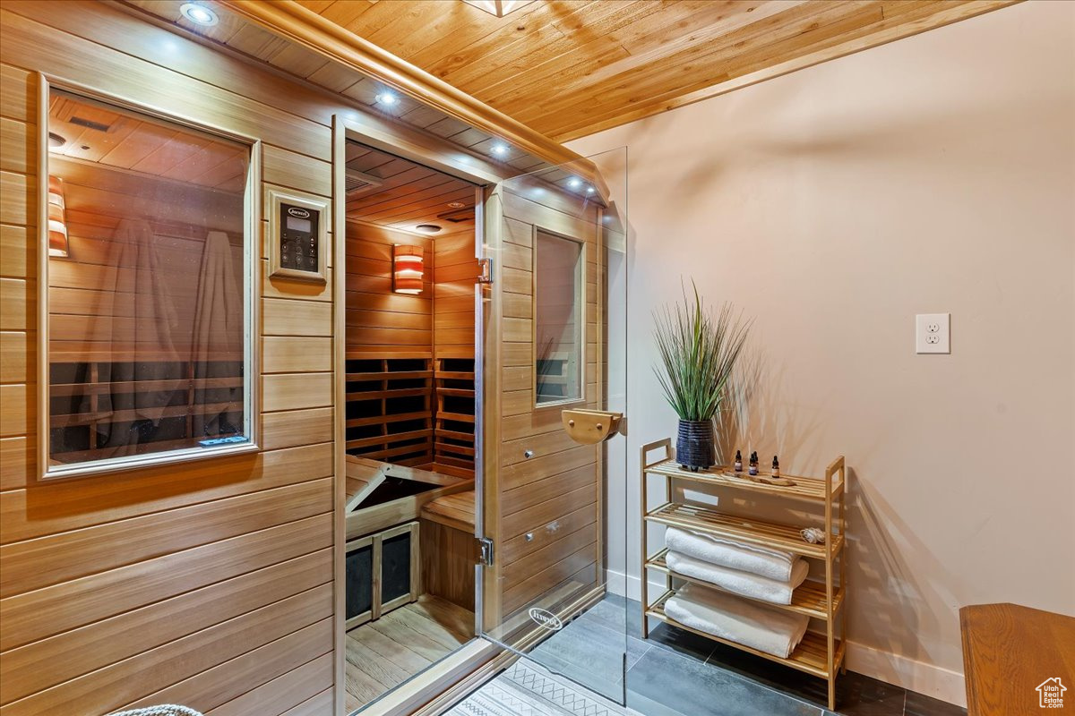 View of sauna / steam room featuring wood-type flooring and wood ceiling