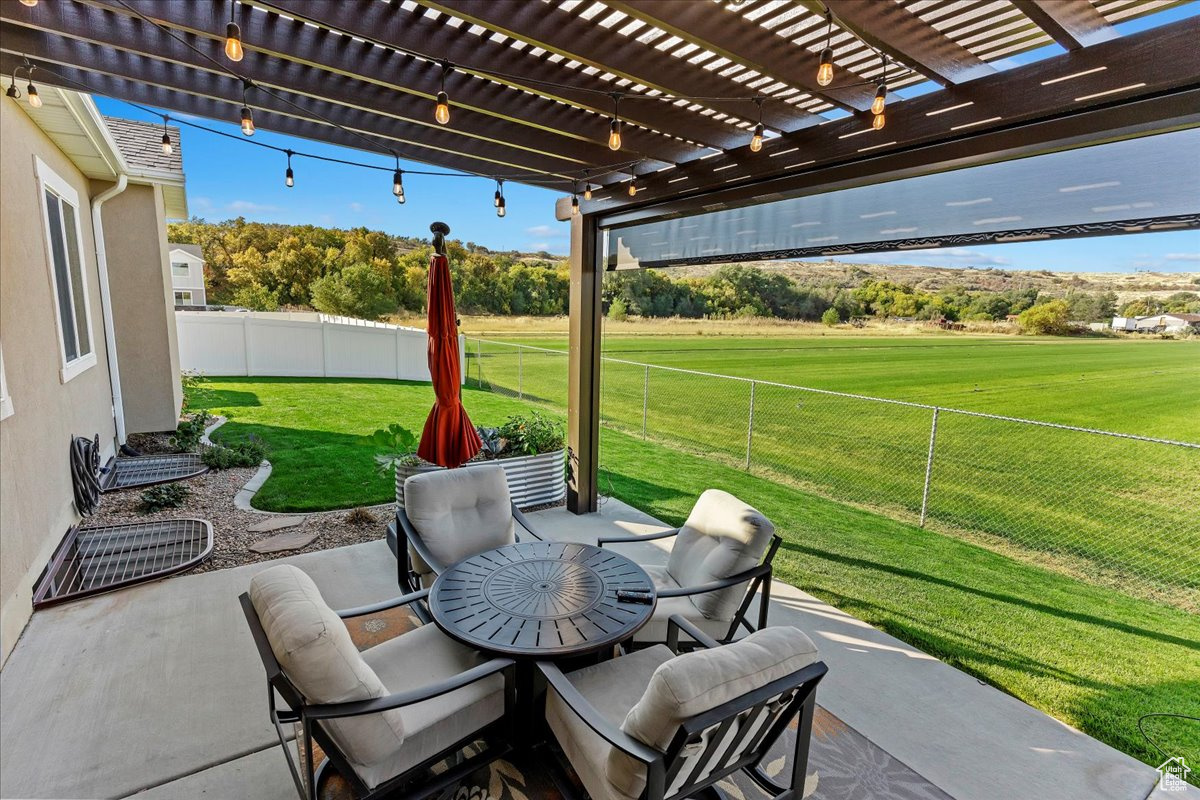 View of patio featuring a pergola