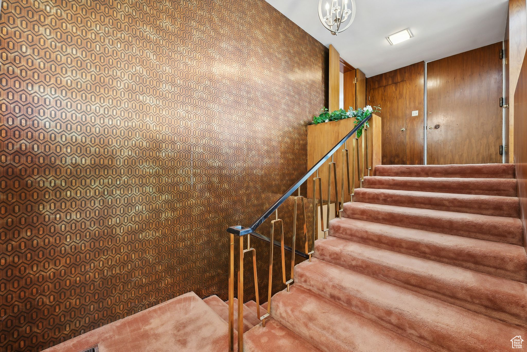 Stairs featuring wooden walls