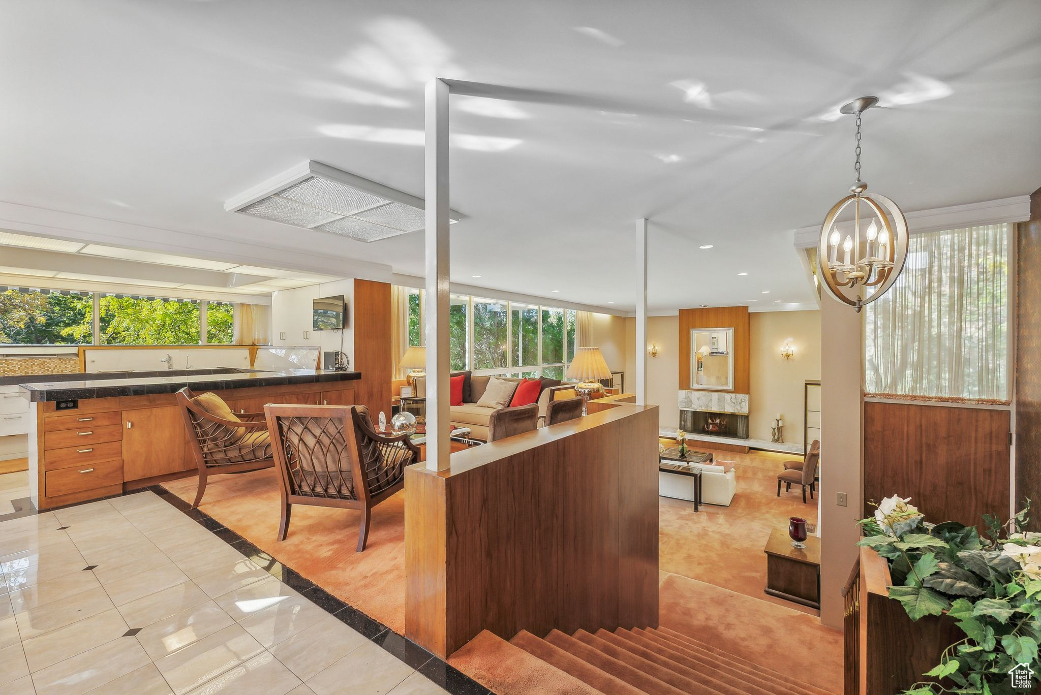 Interior space featuring a notable chandelier and a healthy amount of sunlight