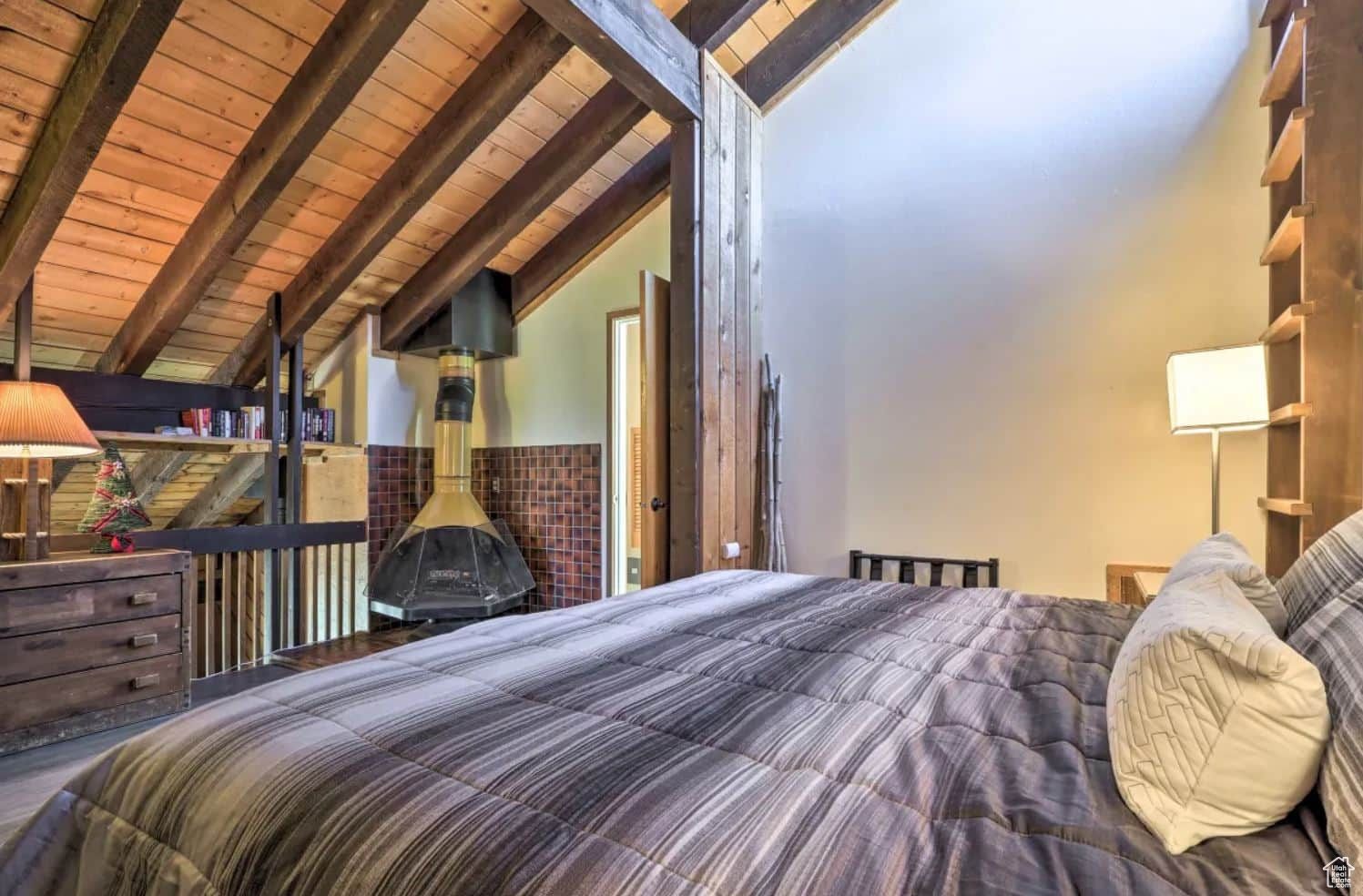 Bedroom featuring vaulted ceiling with beams and wooden ceiling