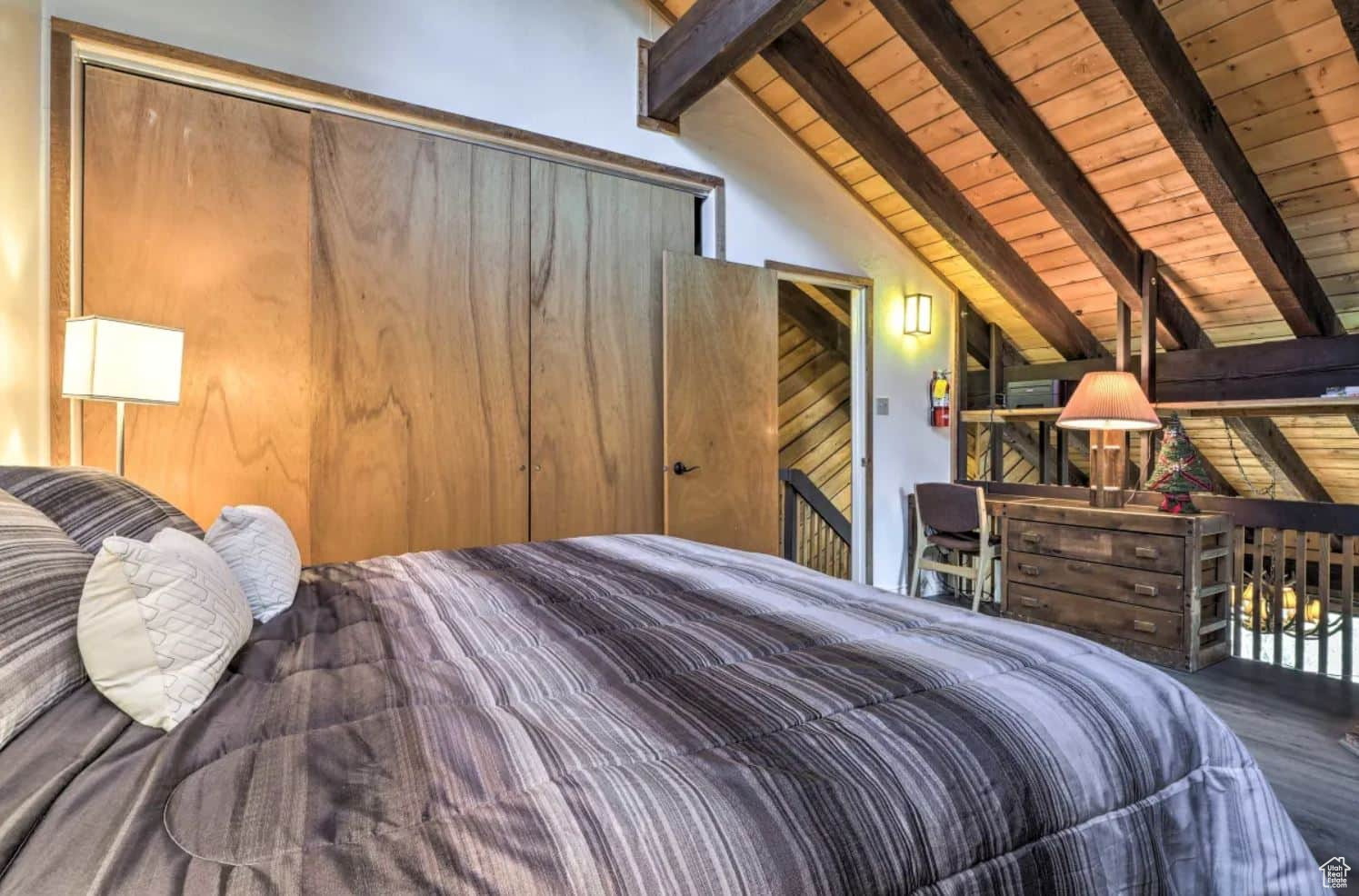 Bedroom featuring lofted ceiling with beams and wooden ceiling