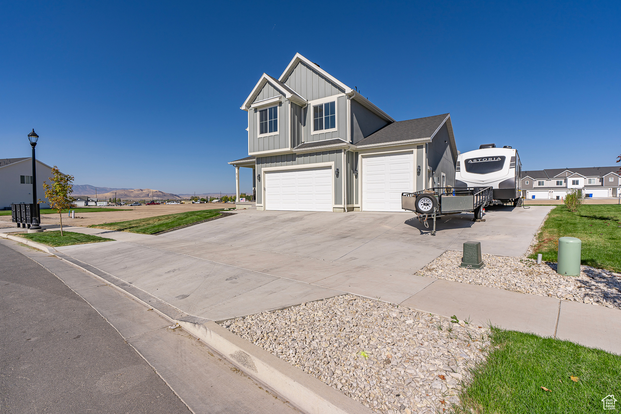 View of front of home featuring a mountain view and a garage