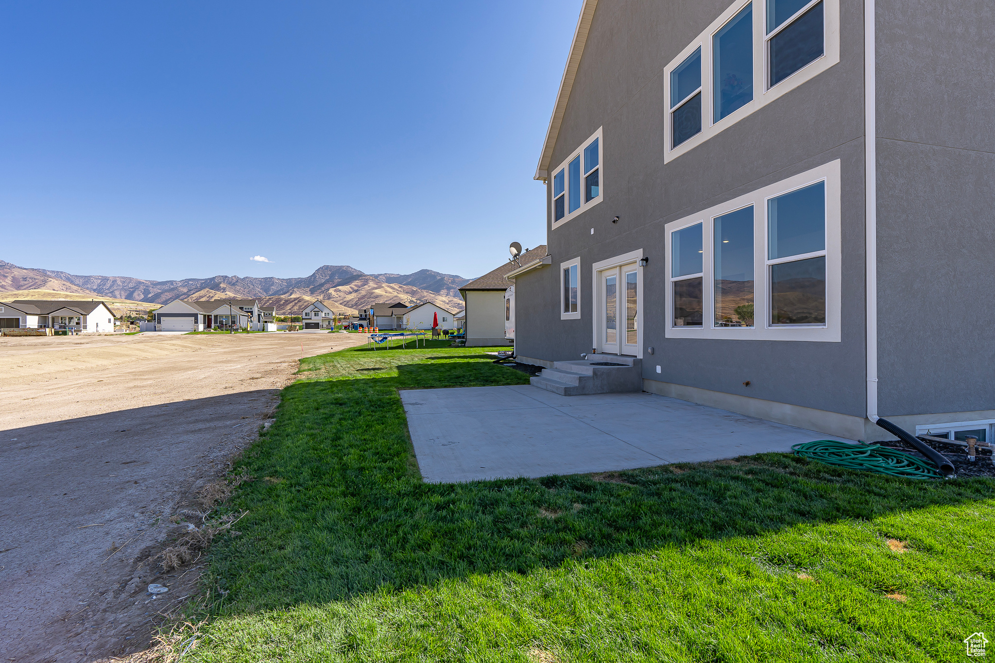 View of yard with a mountain view and a patio