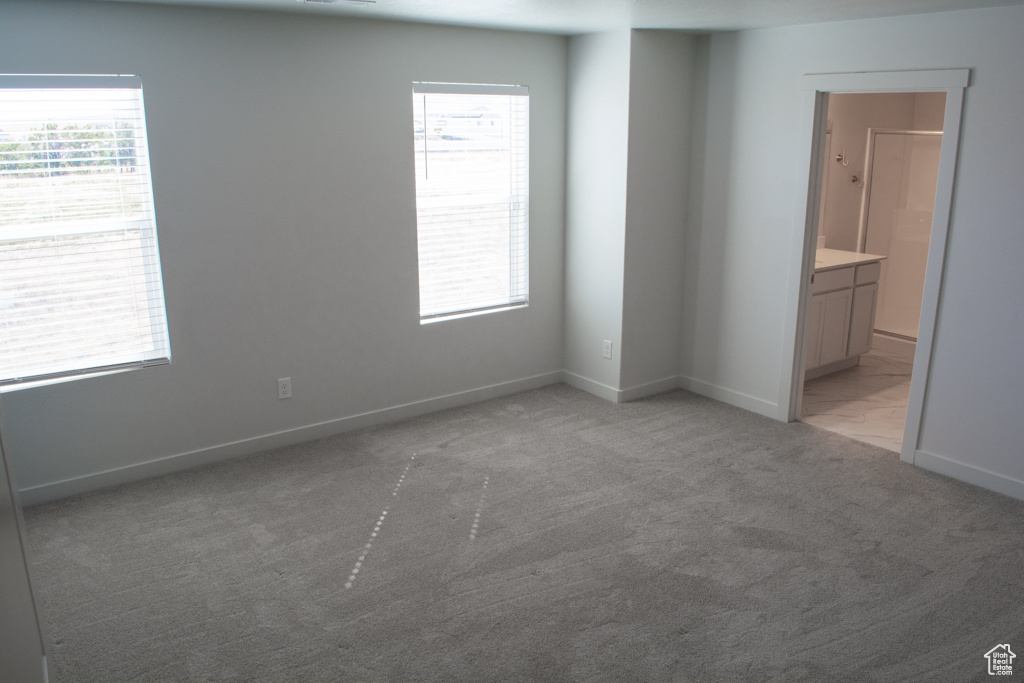 Windows allow ample sunlight in and just to the right is the master bath.